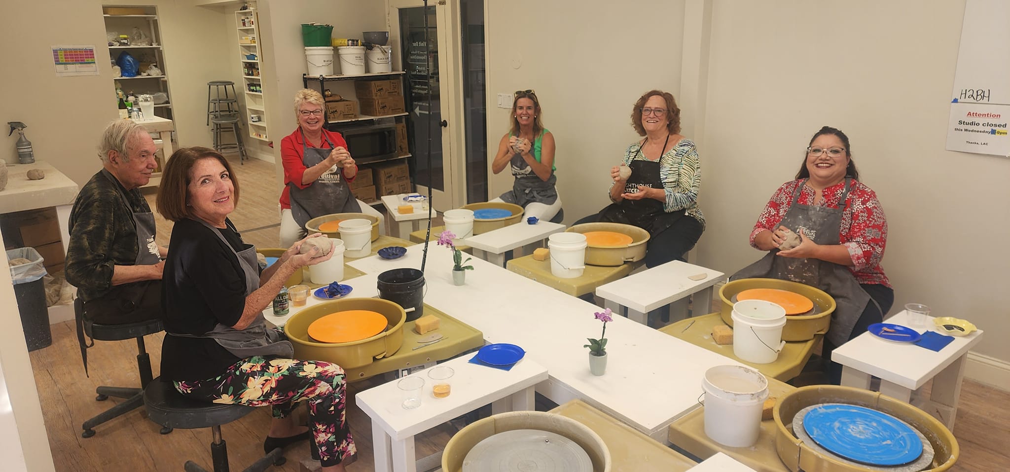 Community members enjoying a pottery workshop